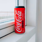 coca cola can on window